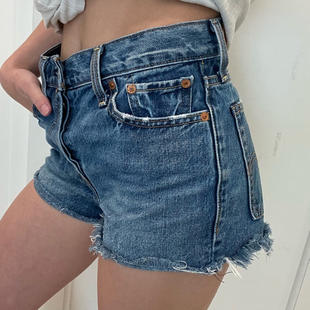 Levi button up jean shorts size 26. Some distressing. High waisted.